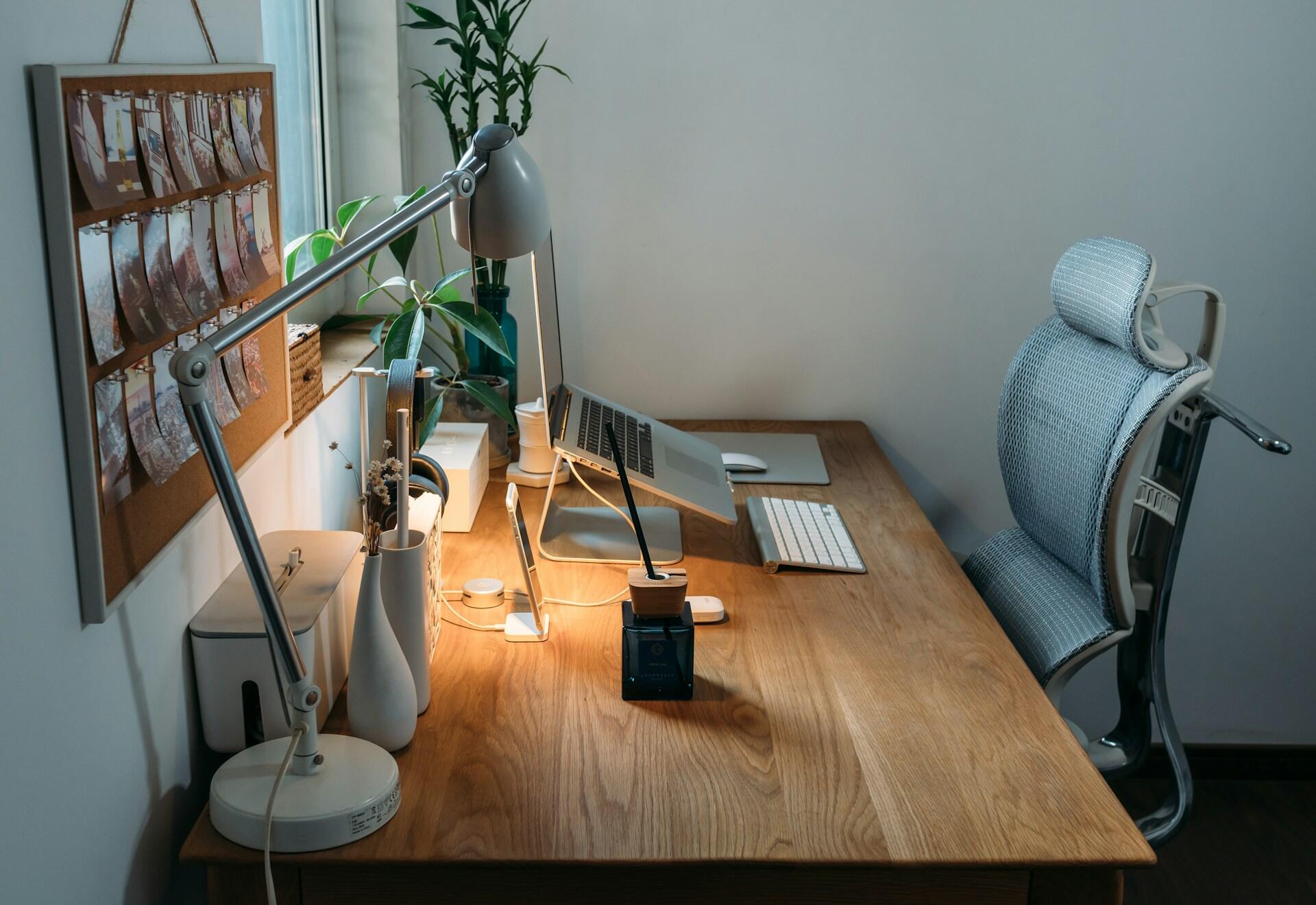 A workspace with a white ergonomic chair.